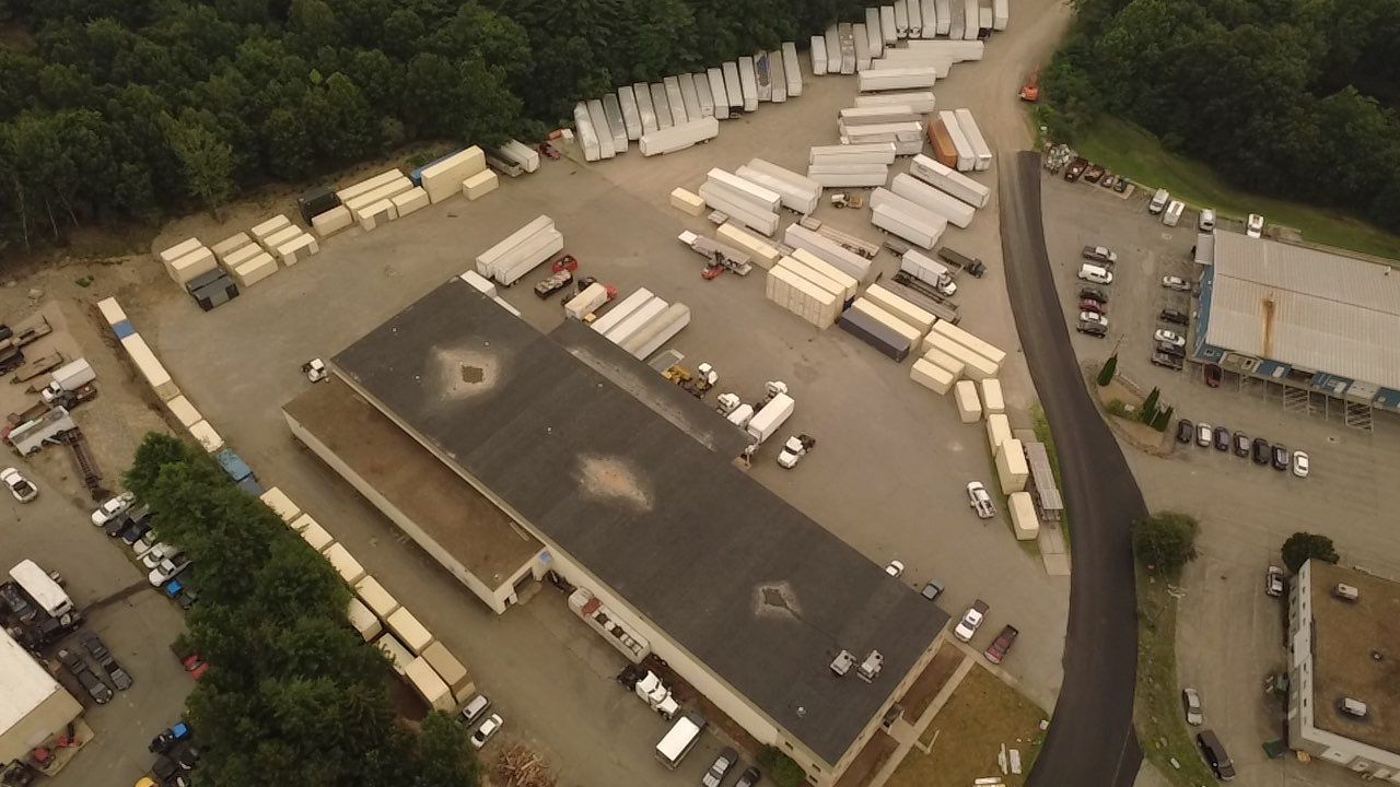 Aerial view of the JP Rivard yard and shop with trailers and containers in Pepperell, MA